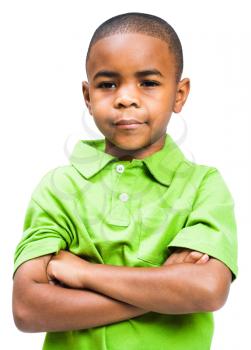 Close-up of a boy thinking with his arms crossed isolated over white