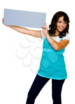 Teenager showing an empty placard and smiling isolated over white