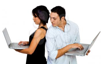 Young couple using laptops and smiling isolated over white