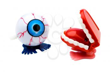 Dentures and eye model isolated over white
