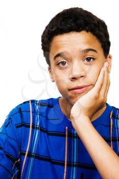Teenage boy thinking isolated over white