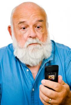 Close-up of a man text messaging on a mobile phone isolated over white