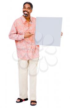 Portrait of a mature man showing a placard isolated over white