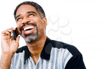 Happy man talking on a mobile phone isolated over white