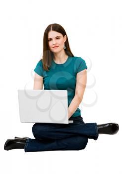 Beautiful young woman using a laptop isolated over white
