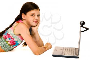 Portrait of a girl using a laptop and smiling isolated over white