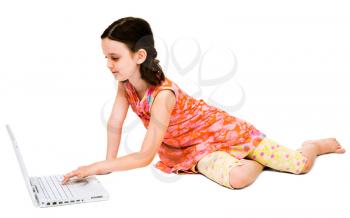 Girl using a laptop and posing isolated over white