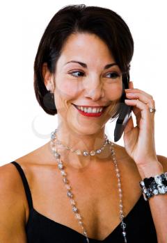 Fashion model talking on a mobile phone isolated over white