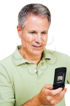 Man text messaging on a mobile phone isolated over white