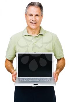Smiling man showing a laptop isolated over white
