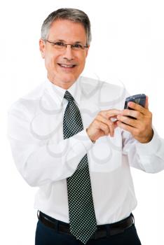 Businessman using a pda and smiling isolated over white