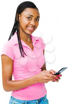 Confident teenager text messaging on a mobile phone isolated over white