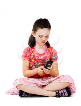 Girl text messaging on a mobile phone isolated over white