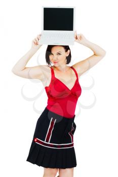 Young woman holding a laptop isolated over white