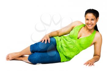 Confident woman reclining and smiling isolated over white