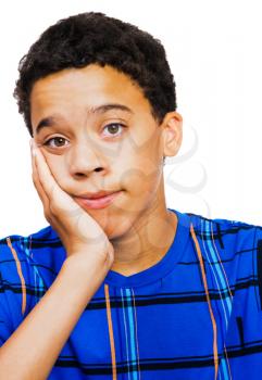 Teenage boy thinking with his hand on chin isolated over white