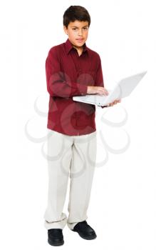 Portrait of a boy using a laptop isolated over white