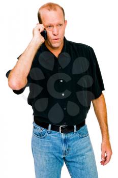 Caucasian man talking on a mobile phone isolated over white