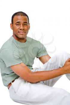 Close-up of a mid adult man posing and smiling isolated over white