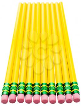 Close-up of pencils in a row isolated over white