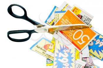Scissors with newspaper cuttings isolated over white