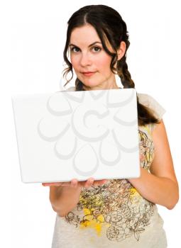 Woman holding a laptop isolated over white