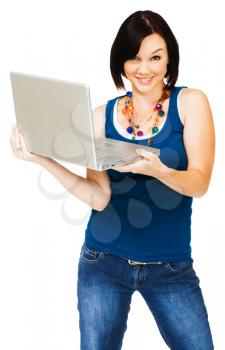 Portrait of a young woman holding a laptop isolated over white