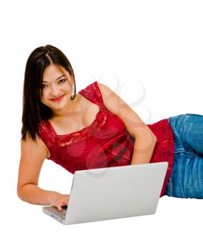 Asian woman using a laptop and smiling isolated over white