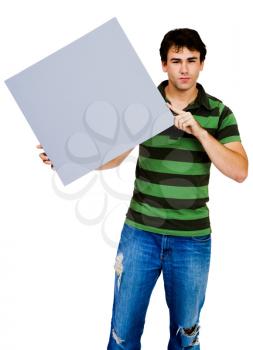 Man showing an empty placard and posing isolated over white