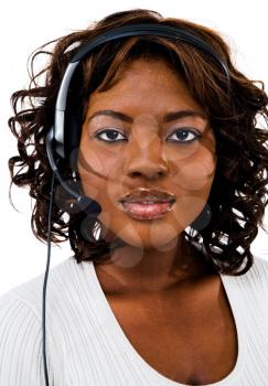 Portrait of a businesswoman wearing headset isolated over white