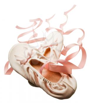 Close-up of pink color ballet slippers isolated over white