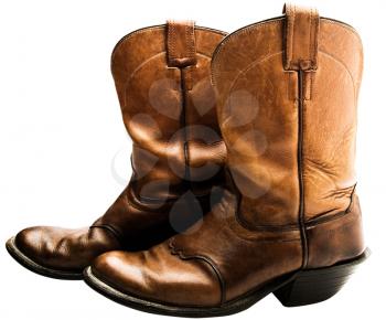 Close-up of cowboy boots of brown color isolated over white