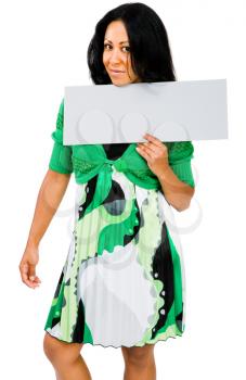 Happy woman showing a placard and posing isolated over white