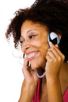 Close-up of a woman listening to music on headphones isolated over white
