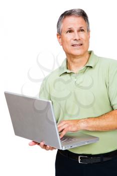 Man using a laptop and thinking isolated over white