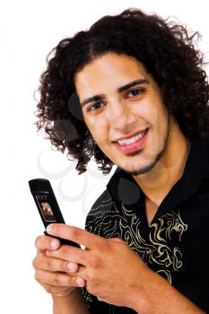 Man text messaging on a mobile phone and smiling isolated over white