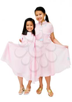 Portrait of two girls posing and smiling isolated over white