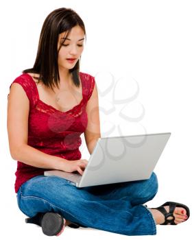 Korean woman using a laptop and posing isolated over white