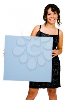 Gorgeous teenage girl showing an empty placard isolated over white
