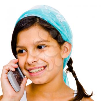 Close-up of a girl talking on a mobile phone isolated over white