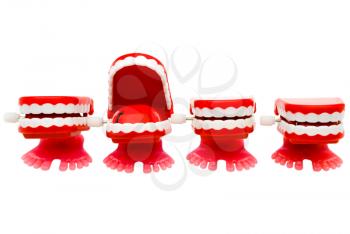 Set of dentures in a row isolated over white