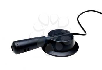 One microphone of black color isolated over white