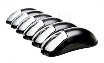 Close-up of computer mouses in a row isolated over white