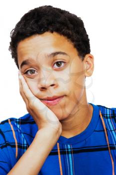 Close-up of a teenage boy thinking isolated over white