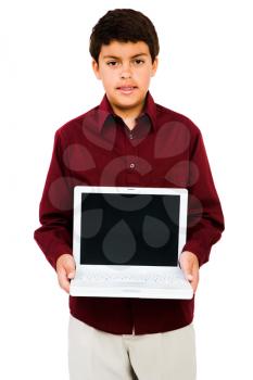 Boy showing a laptop isolated over white