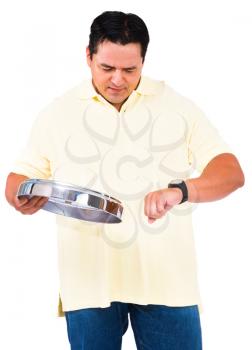 Man checking the time in the wristwatch isolated over white