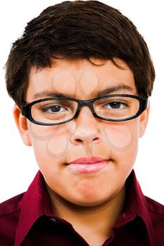 Close-up of a boy wearing eyeglasses isolated over white