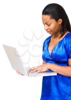 Woman using a laptop isolated over white