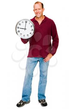 Mature man showing a clock and smiling isolated over white
