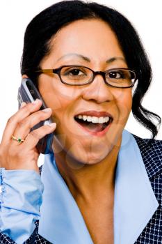 Portrait of a businesswoman talking on a mobile phone isolated over white